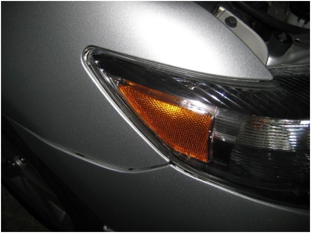 Где расположена маркировка лампы ближнего света Toyota Corolla 150?